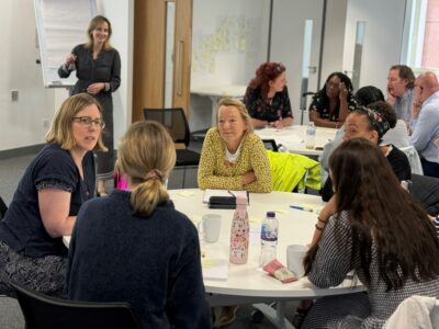 Image of people discussing in a group