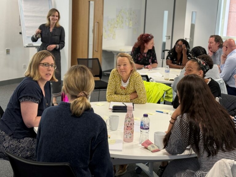 Image of people discussing in a group